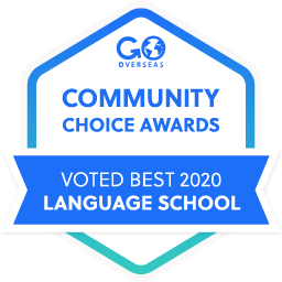 Blue hexagon award banner displays Community Choice Awards, and Voted Best 2020 Language School.